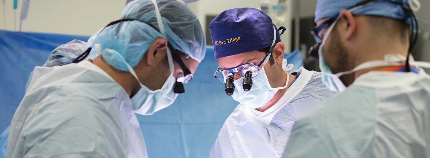 Three UC San Diego surgeons in the operating room